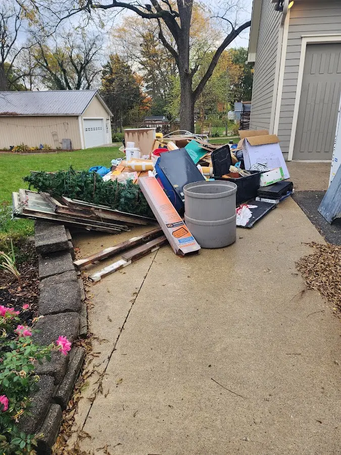 Dumpster being loaded with debris for 3 Yard Dumpster Rental in Rossville